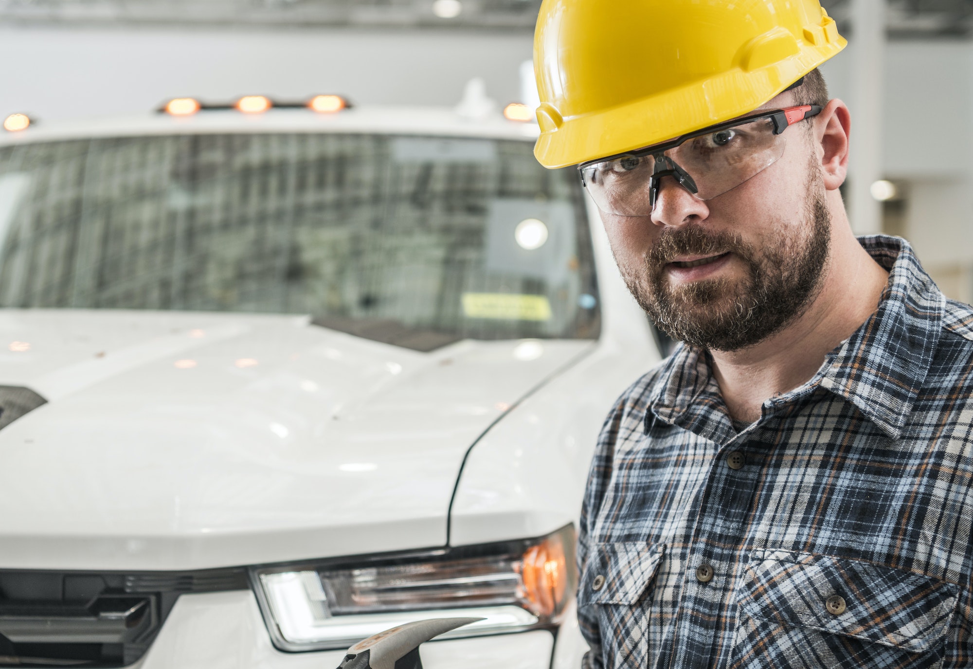 General Construction Contractor Worker in Front of Pickup Truck